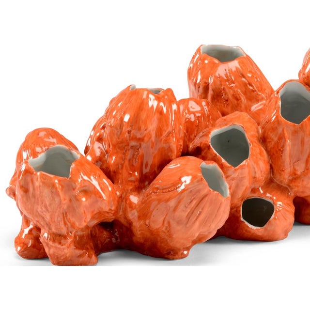 Add a burst of color to your coastal decor with our orange glazed porcelain barnacles. This nature inspired accent if...