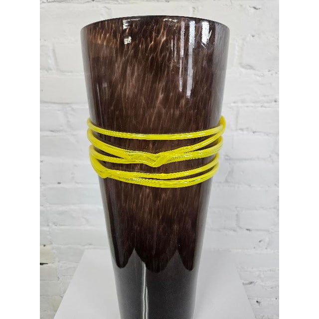 Contemporary art glass vase with wrapped yellow rope embellishment which adds texture and color pop. Dimensions: 16.5"H x...