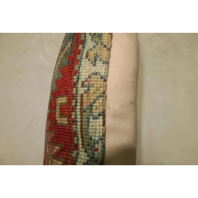 Pillow made from an early 20th century Caucasian Rug. Zipper closure and foam insert provided. 13'' x 17''