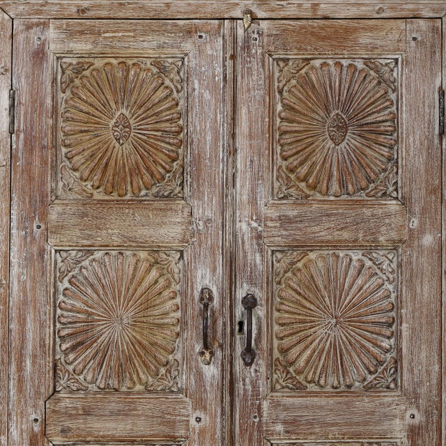 Antique Anglo-Indian carved teakwood armoire, traditionally known as an almirah, once used throughout India for storing...