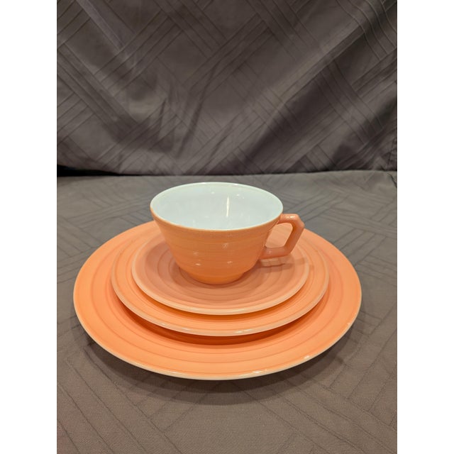 A stunning, highly collectible 16-piece "rainbow" pastel dinnerware service for four from the late 1930s to 1940s....