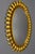 Mid-century gilt metal sunburst-shaped mirror, Germany, circa the 1950s. A beautiful Hollywood Regency-style oval sun- or...