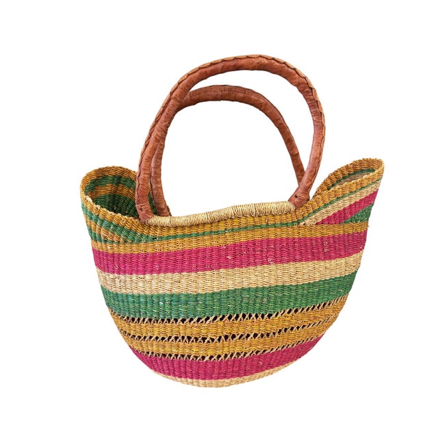This African Bolga Basket from the Bolgatanga region of Ghana, inspired by Saint-Tropez French Riveria town, is of...