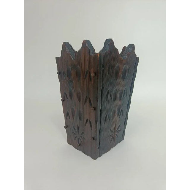 The umbrella stand has a angular finish at the top, which is finished in the same way and is slightly darker in color. The...