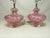 Pair of pink Murano art glass lamps, c.1950’s Featuring prominent swirled ribs and a distinctive pink color with silver...