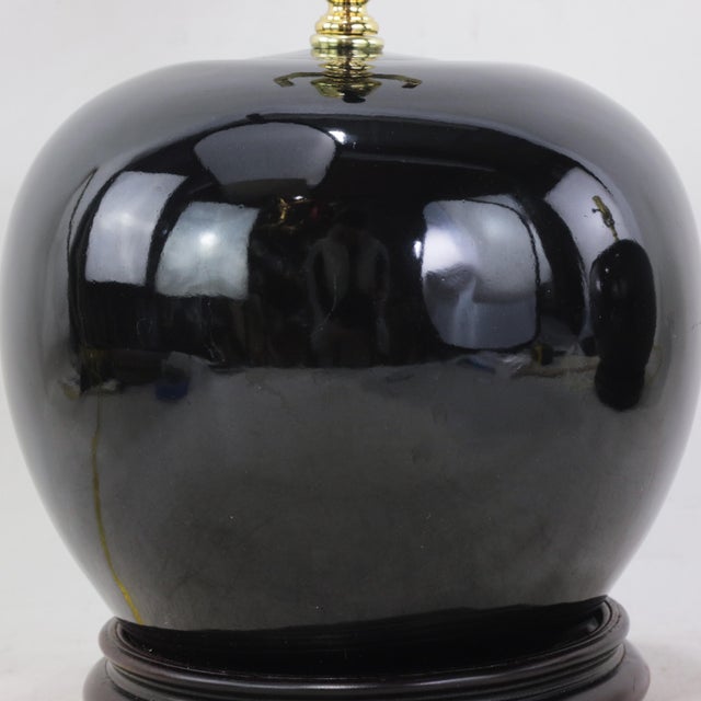 A Pair Early 20th Century Black Monochrome Porcelain Watermelon Jar Table Lamps on Carved Wood Bases For Sale - Image 13 of 15