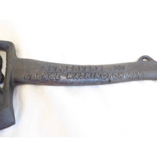 This 20th Century iron axe commemorates the American Revolution. On the handle it reads, "Independence 1776, George...