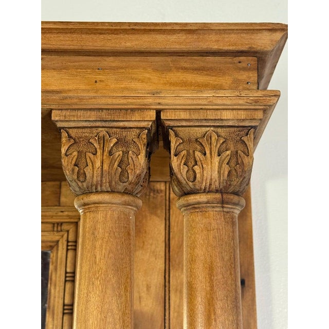 A substantial and beautifully detailed antique European architectural fireplace mantel, handcrafted in solid hardwood and...