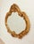 Louis XV Style Gilt Wall Mirror with Rococo Carved Floral Frame is Inspired by simple, minimalist forms, this vintage...
