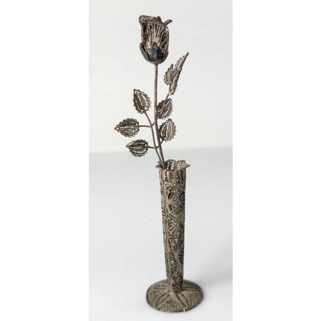 We are selling this cool small sterling silver filigree vase with a solitary rose flower, all made out of beautiful silver...