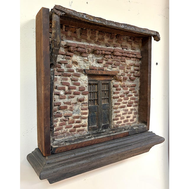 Very unique original signed mixed media Trampe art wall sculpture from 1907. The sign over the door reads in Spanish...