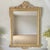 Item Description Elevate your interior with this stunning antique mirror featuring a gesso over wood frame in the lavish...