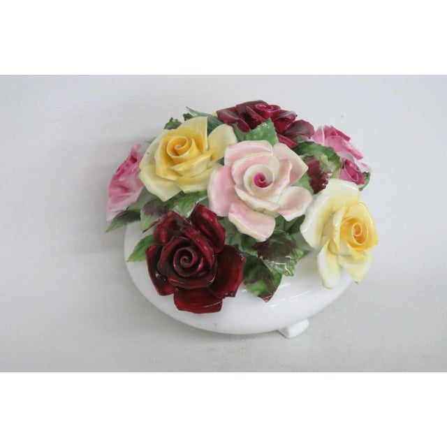 This gorgeous Floral Figurine is made of fine bone china. This darling collectible is marked on the bottom with the...