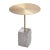 Side Table Raw Granite features a round brushed brass table top. Base is a block of grey granite with rough, unpolished...