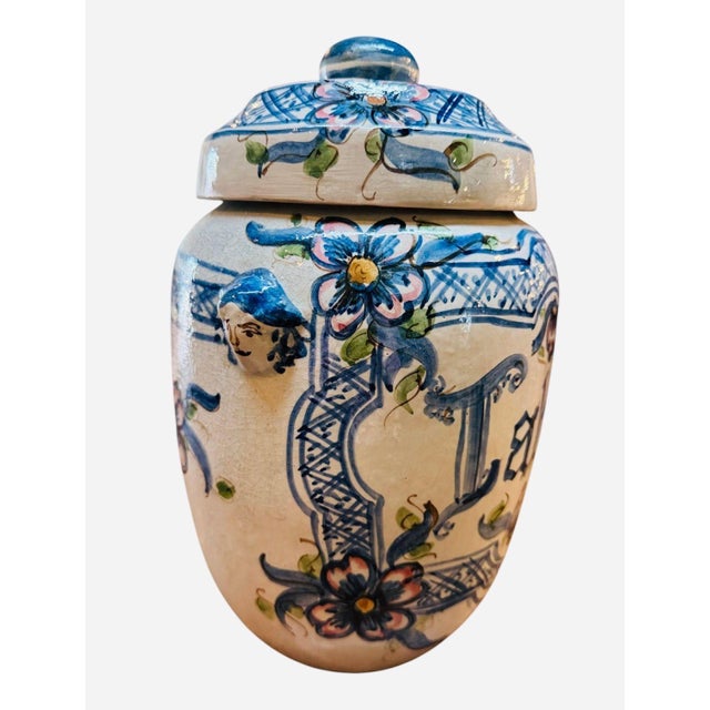Hand painted Spanish apothocary tabac jar, circa 1900. Painted with a crosshatch trellis border, floral sprays, and a...
