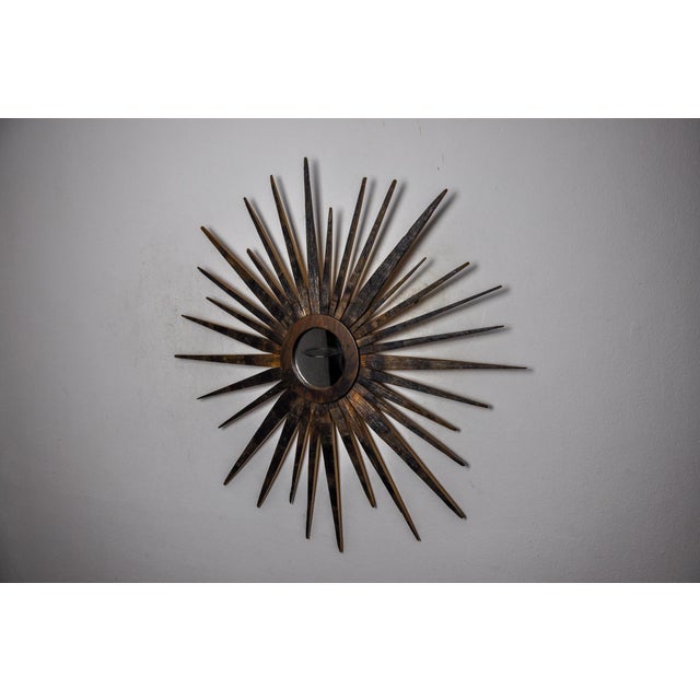 Very beautiful and rare wooden sun mirror made in France in the 1960s. Superb woodwork known as popular art. Very good...