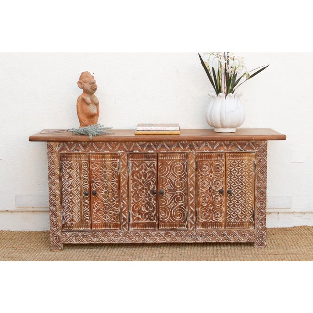 Spanning 72 inches, this reclaimed teak sideboard is a masterwork of Southern Indian carving. Each of its six doors serves...