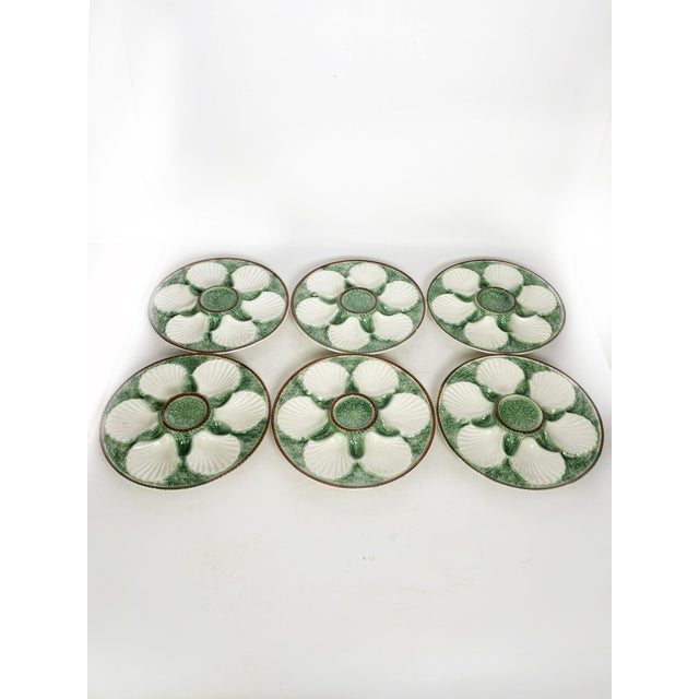 The dimensions are those of a plate. Set of 6 glazed ceramic oyster plates, made in France in the 1960s. This charming...