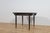 This extendable table was manufactured in Great Britain in the 1950s. Brass feet add elegance to the table. The entire...