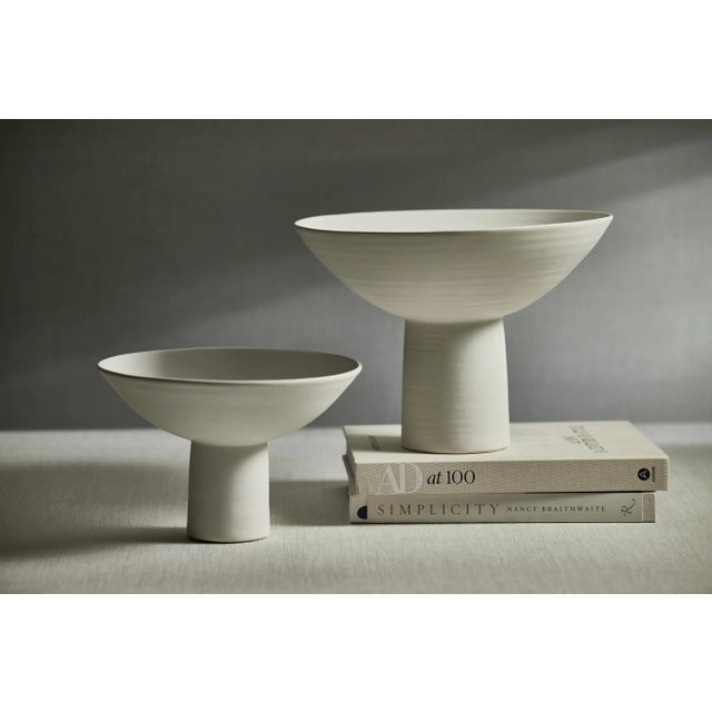 This beautiful serving bowl features a matte white finish, which means your favorite fruits will stand out brightly...