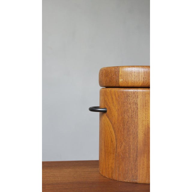 Ice bucket made of teak. Made in the 60s by Digsmed, Denmark. The ice bucket has an original plastic insert. Two side...