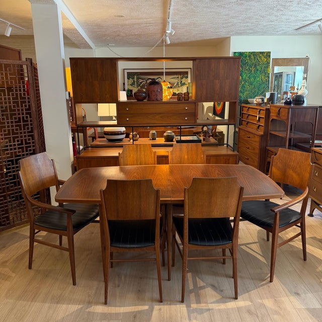 A striking mid-century modern dining set from the coveted “Delineator” line, designed by Paul McCobb for Lane Furniture,...
