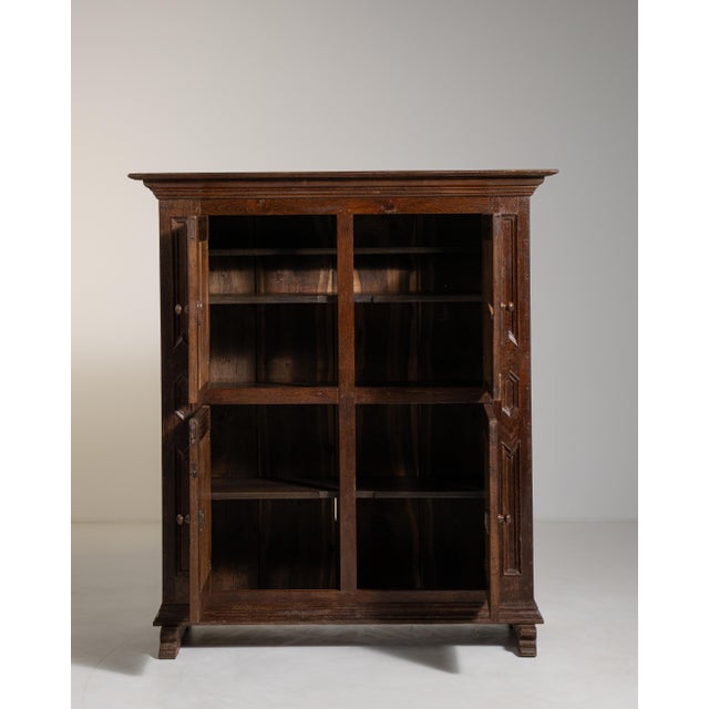 A rare and distinguished example of early 19th-century French craftsmanship, this Neo-Baroque cabinet embodies the...