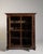 A rare and distinguished example of early 19th-century French craftsmanship, this Neo-Baroque cabinet embodies the...