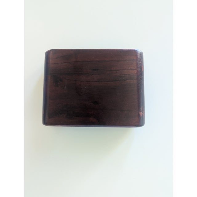 Wonderful Chinese scroll stand. Carved from one piece of wood, wonderful scroll shape either end. Dates from the 1920s. In...