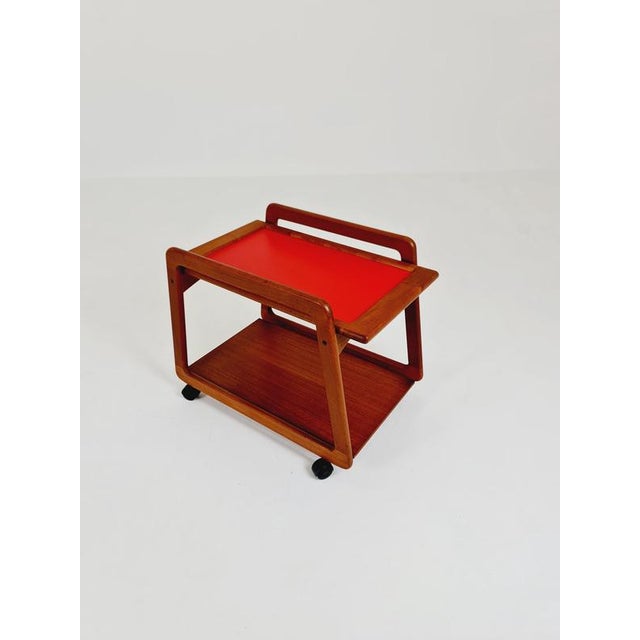 Vintage mid-century danish teak trolley/bar cart by sika mobler, 1960s. It is in very good condition; however, as with all...