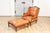 This elegant 20th-century French walnut chair and ottoman set exemplifies the timeless charm of traditional French design....