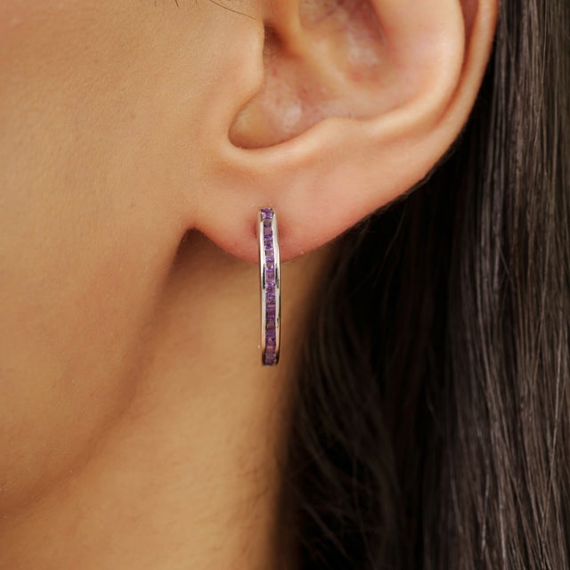 Add a touch of elegant color to your jewelry collection with these beautiful natural amethyst half hoop earrings crafted...