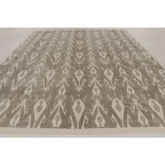 Handwoven in cotton, this 12x15 contemporary oversized flatweave dhurrie rug joins Rug & Kilim’s Dhurrie collection,...