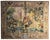 A large-scale decorative tapestry depicting King Louis XIV on horseback, set within an ornate border featuring classical...