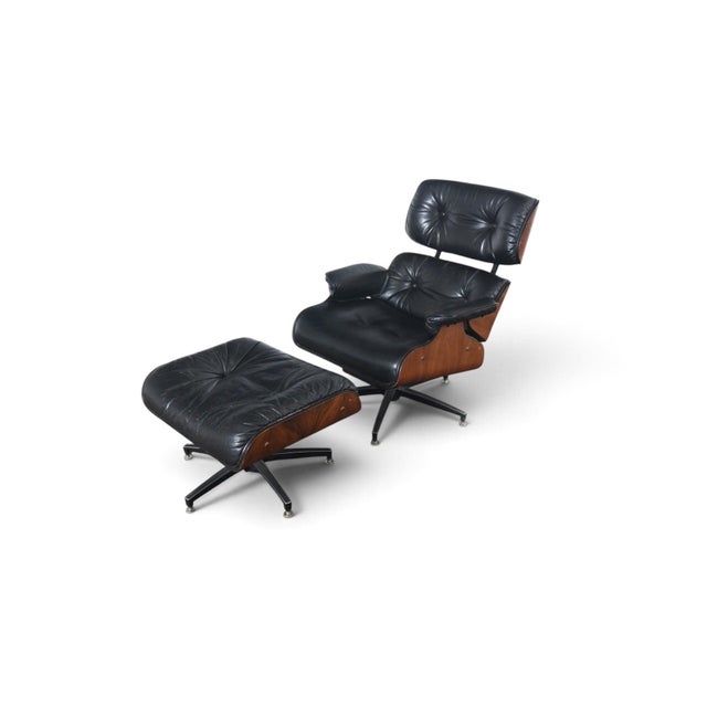 This lounge chair and ottoman were produced by Charlton Company in the USA during the 1970s. The walnut frame is paired...