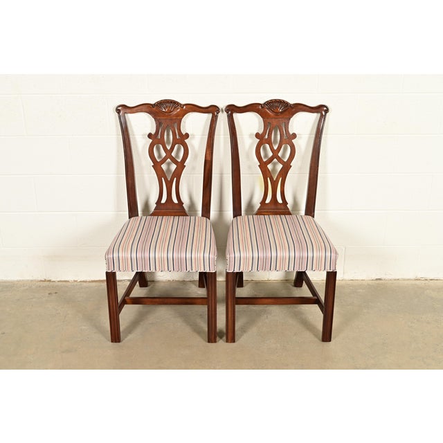 An outstanding pair of Chippendale or Georgian style side chairs or dining chairs By Drexel Heritage USA, Circa 1980s...