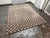 Design Plus Gallery presents a 8ft 6in × 11ft 7in Contemporary Checkered Hand Tufted Wool Area Rug. The rug has a taupe...
