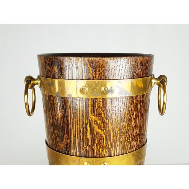 Oak and brass ice bucket with internal aluminum tray by Geraud Lafitte Ouvrier, 1950s. Good condition. No breakages or...