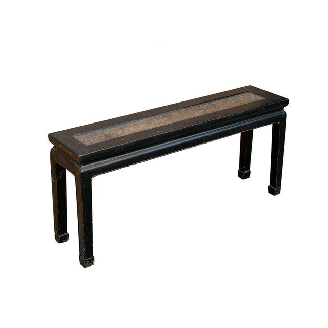 This refined Ming-style long bench features a classic waisted design and a deep, weathered black lacquer finish that...