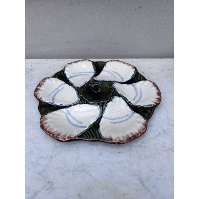 French Majolica oyster plate signed Longchamp, circa 1900.