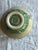 Beautiful Handmade Green and Ivory Pottery Bowl with a small flower frog insert. Could be used for decoration, as a...