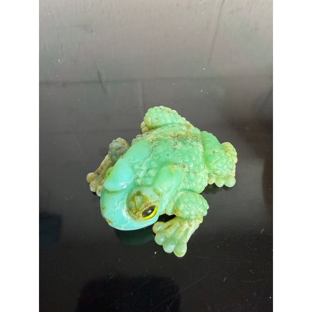 Quite lovely hand carved chrysoprase bullfrog with glass eyes. Very unique and is the perfect size to use as a paperweight...