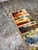 Design Plus Gallery presents the 2ft 2in × 6ft 8in Color Chart Runner Rug by Elson & Company. This hand-knotted wool...