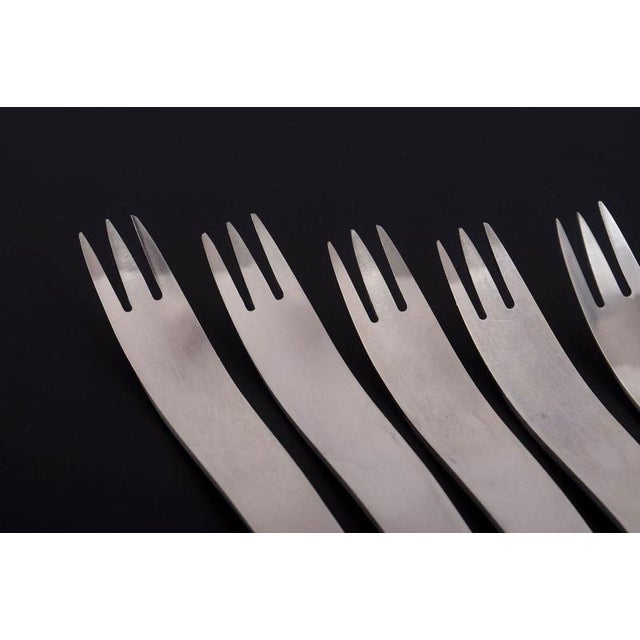 Arne Jacobsen for Anton Michelsen, set of six dinner forks. Set of six stainless steel dinner forks featuring Arne...