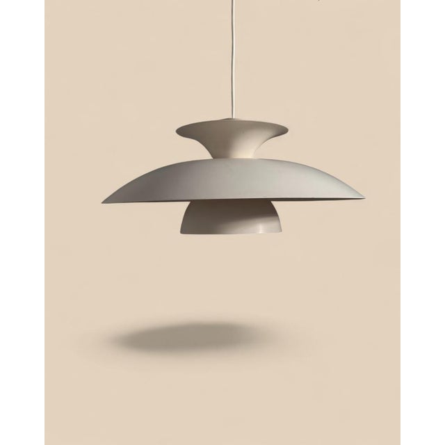 Scandinavian pendant lamp, 1960s–70s Denmark / Sweden A minimalist Scandinavian pendant lamp made of lacquered metal,...