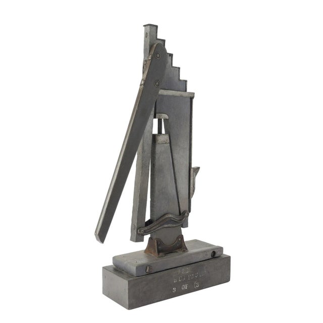 Dynamic and abstract sculpture of a wagon jack constructed out of wood and metal by Janet Sullivan Turner (1935–2008). The...