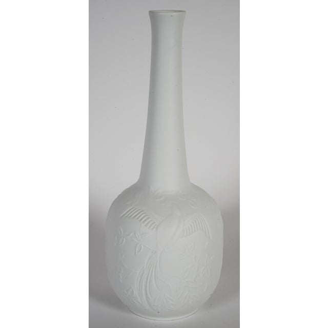 This is a vintage AK Kaiser matte white bisque porcelain vase with a bird and floral relief design. It was produced in...