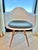 A Vitra/Eames original and design classic! Molded white dining armchairs with affixed grey-blue upholstered seat pads,...