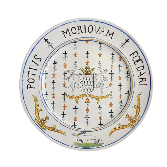 An antique 19th Century French Alcide Chaumeil faience plate. Featuring a well-balanced and delicately hand-painted...