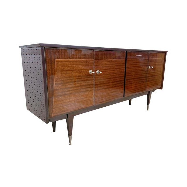 Vintage mid-century modern French mahogany enfilade manufactured in France, c.1950s. Features (left-to-right) a locking...